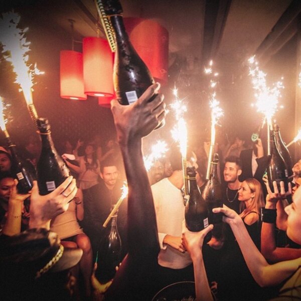 people celebrating at a club in hong kong