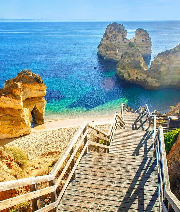 Beach views with wooden staircase to Praia do Camilo