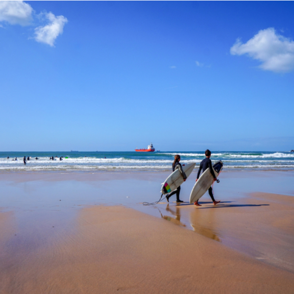 surfers walking on Matosinhos Beach
