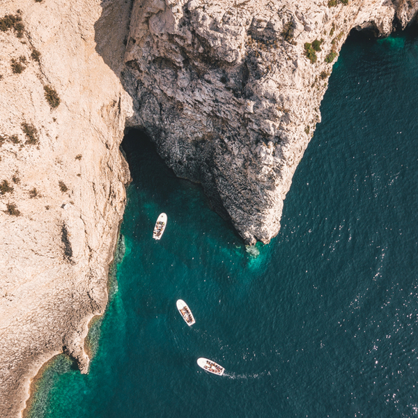 boats entering the blue cave in croatia