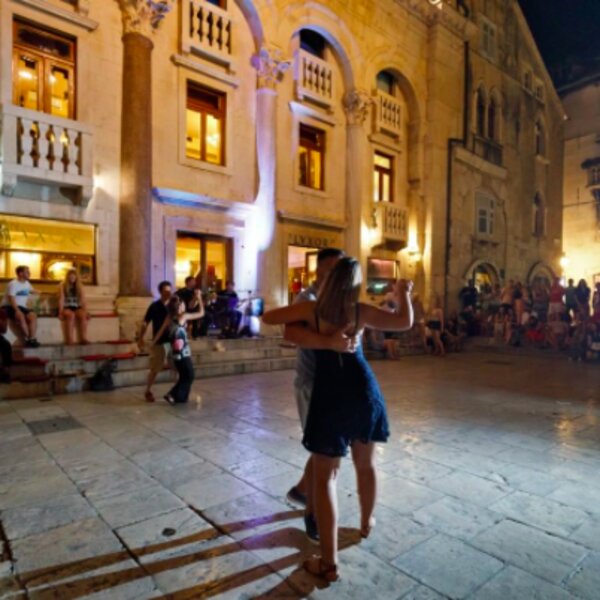 people dancing outside bar in split