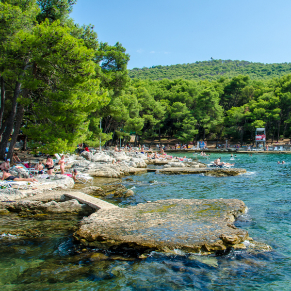 people swimming in lake at marjan park