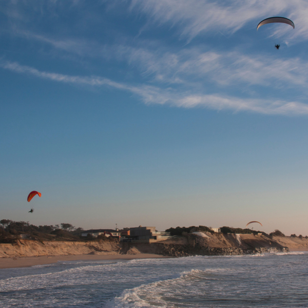 kite-surfers over the sand at ofir beach