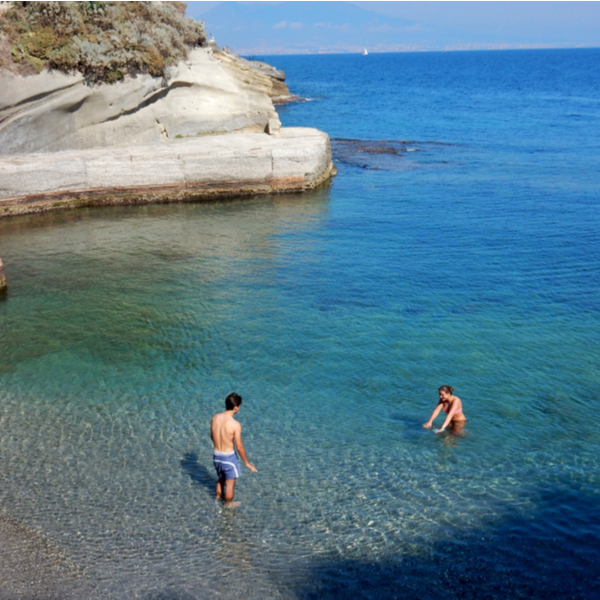 people swimming in the sea at Gaiola Beach