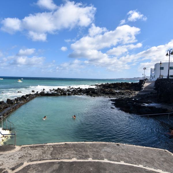 people swimming in the natural pools of Punta Mujeres