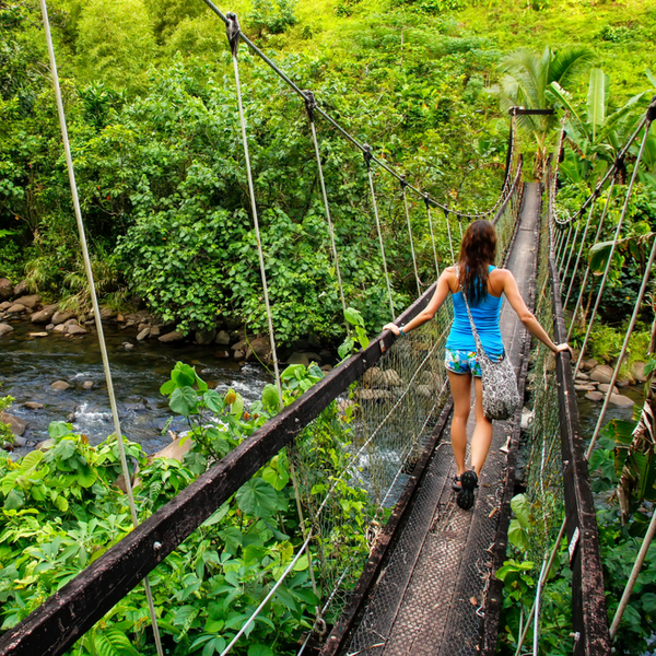 woman walking on Taveuni suspension bridge