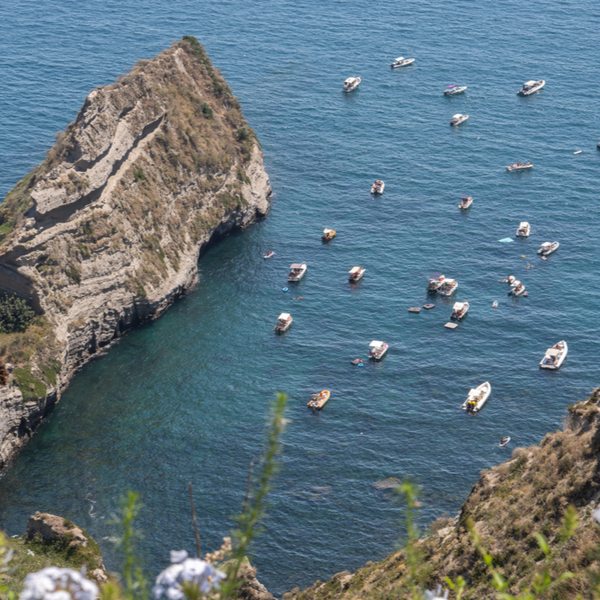 boats visiting Trentaremi Bay in naples