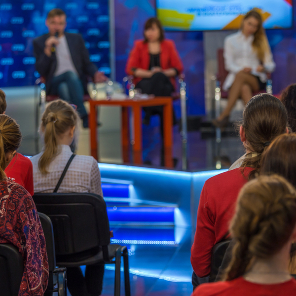 people in audience of live recording of tv show