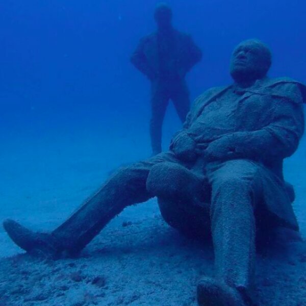 divers exploring underwater sculptures in lanzarote
