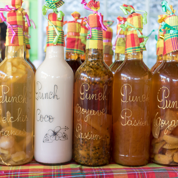homemade rum drinks at market in grenada
