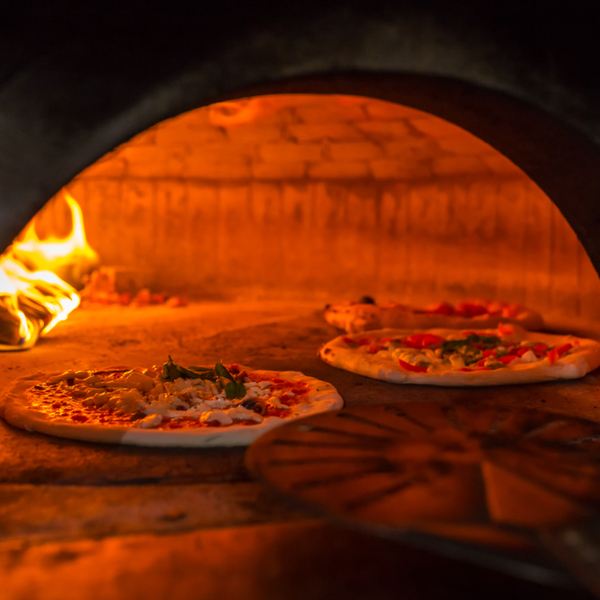 Neapolitan pizza cooking in wood oven in naples in