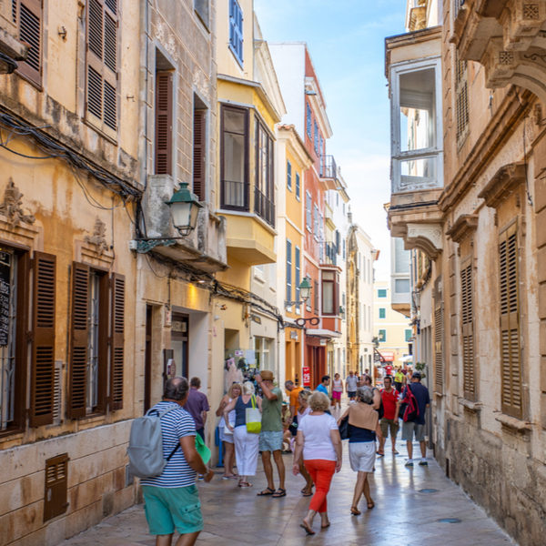 people wandering the historic streets of Ciutadella in menorca