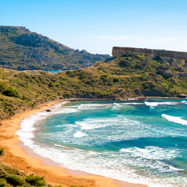 red sand beach at Ghajn Tuffieha bay in malta