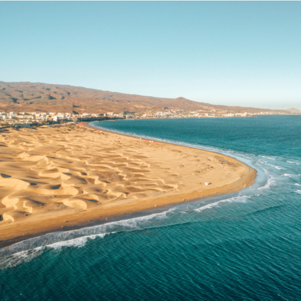 view of sea and sand dunes at Maspalomas beach in gran canaria