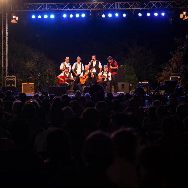 people enjoying a traditional performance at ghanafest in malta
