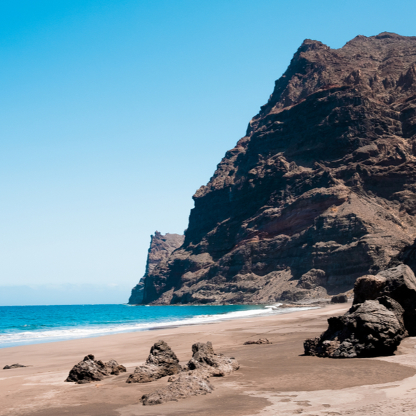 cliff and blue sea at gui gui beach in gran canaria