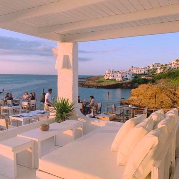 menorca beach club at sunset with sea view
