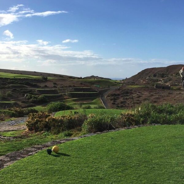 gran canaria golf course with mountains and sea view