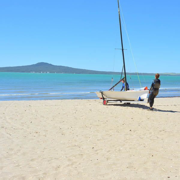 boy with boat at Kohimarama beach