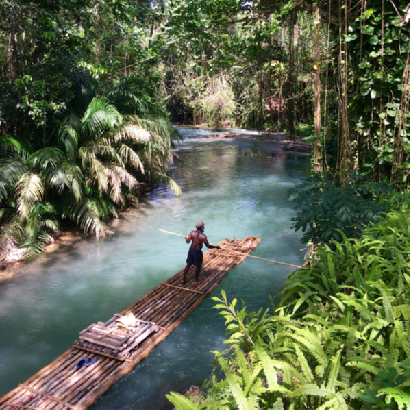 man rafting on Martha Brae River in jamaica