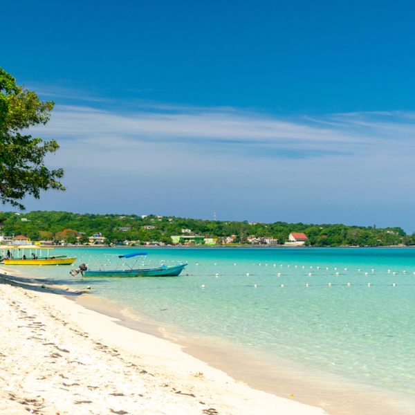 boats sitting on seven mile beach in jamaica