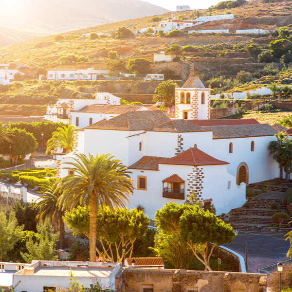 view of whitewashed buildings on hillside in betancuria in fuerteventura