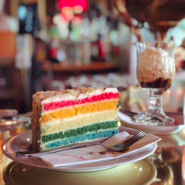 eating rainbow cake at a coffee shop in vienna