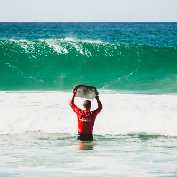 man surfing at flag beach in fuerteventura