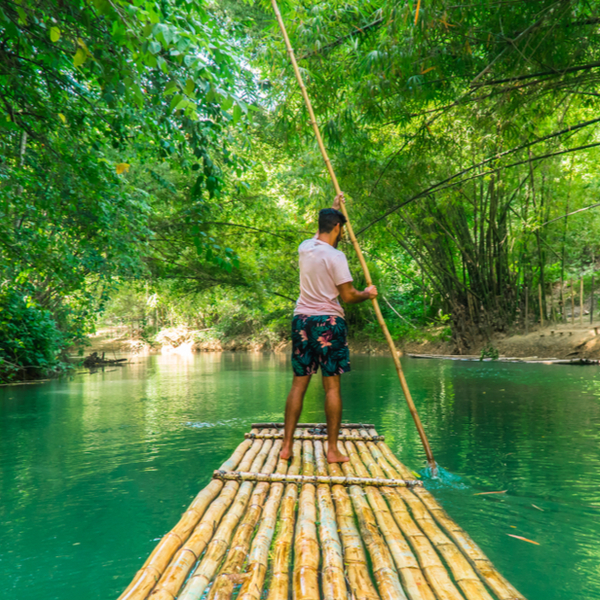 man on raft on Martha Brae River