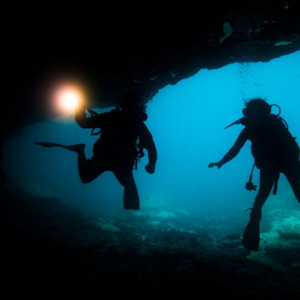 divers exploring secret grotto in fuerteventura