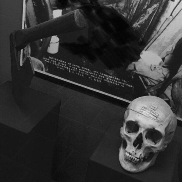 axe and skeleton in exhibit at vienna crime museum