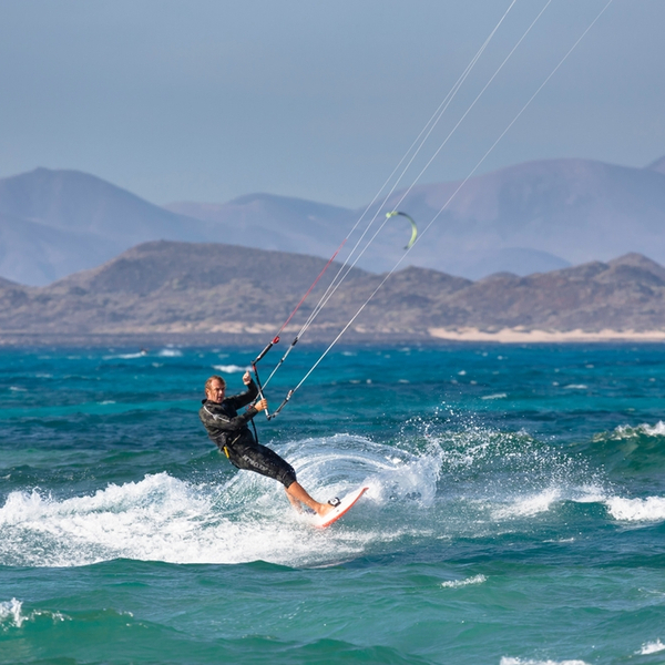 man kitesurfing on fuerteventura beach