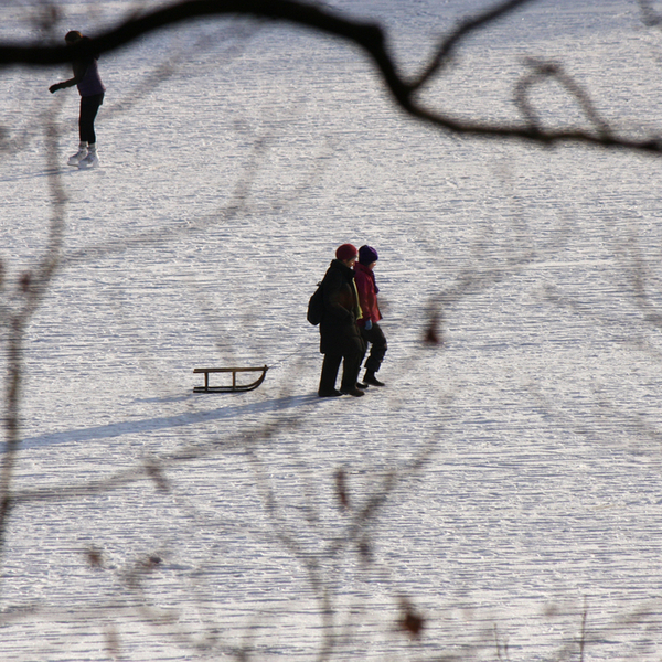 people walking on the frozen Schlachtensee lake in berlin in winter