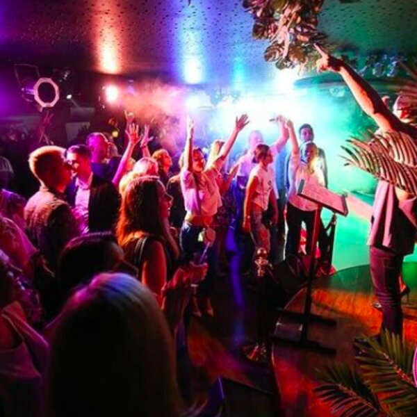 people singing at karaoke bar in riga
