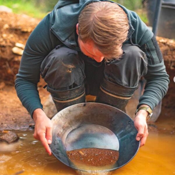 man panning for gold in lapland