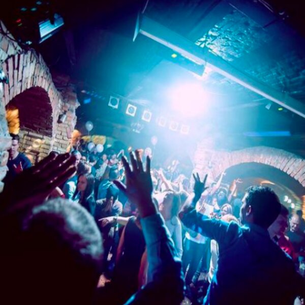 people dancing at a club in riga