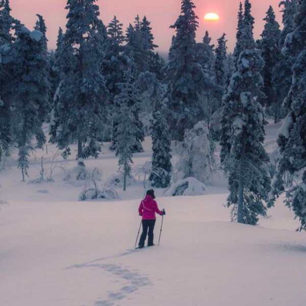 person skiing in resort in lapland