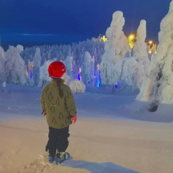 child on snowy slope at a ski resort in lapland