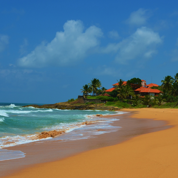 clear sand and house at Induruwa Beach in sri lanka