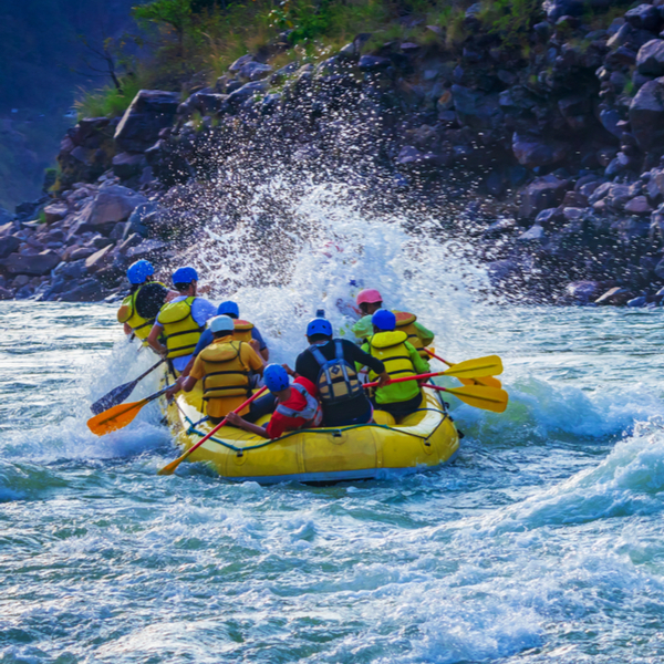 group of people riding the rapids in goa