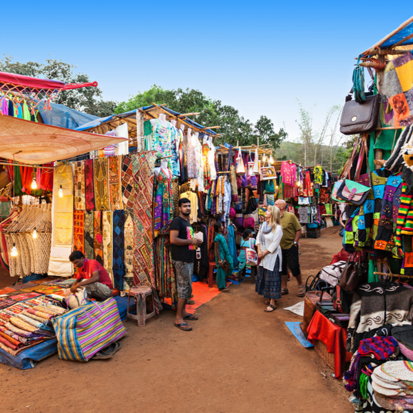people shopping at flea market in goa