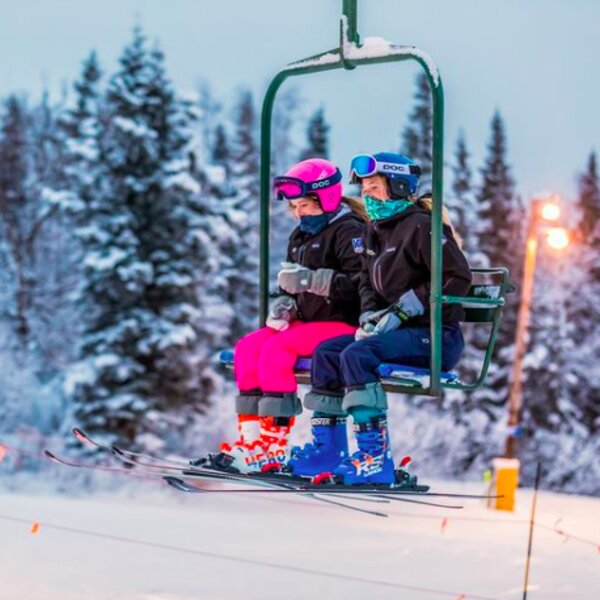 people on ski lift at alaska ski slope