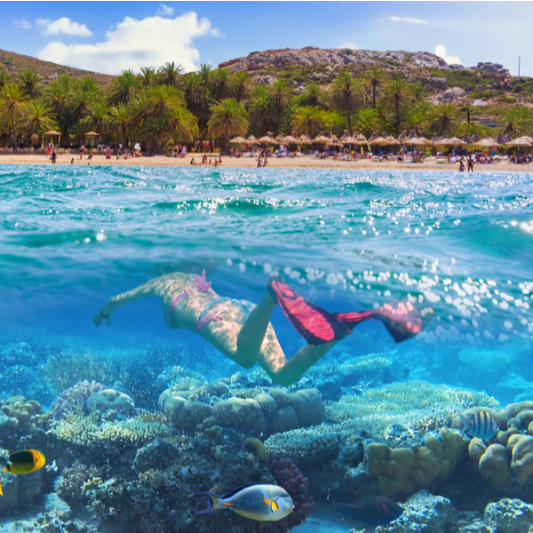 person snorkelling at crete beach
