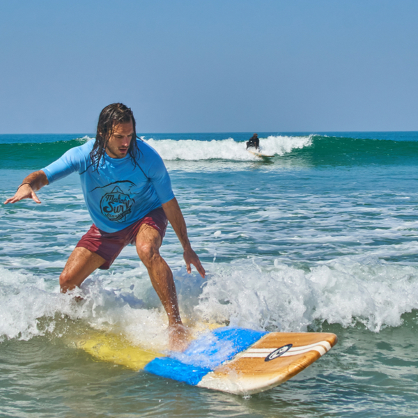 man surfing at agonda beach in goa