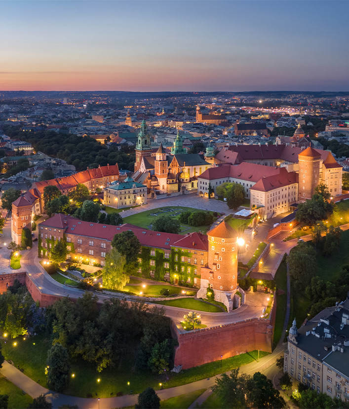Krakow, Poland. Aerial view of illuminated Wawel Royal Castle on sunset