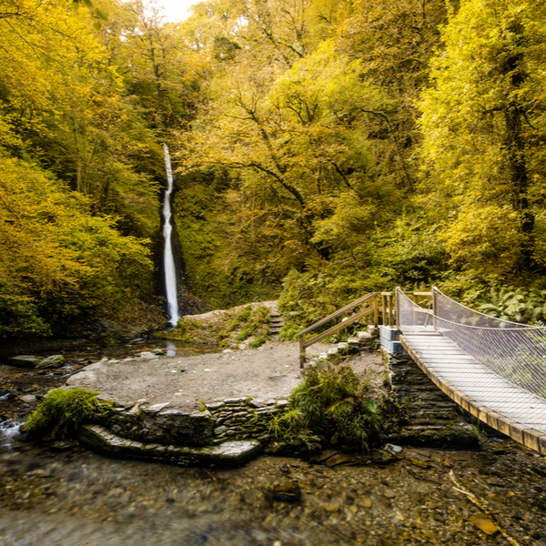 drawbridge and waterfall in lydford gorge devon