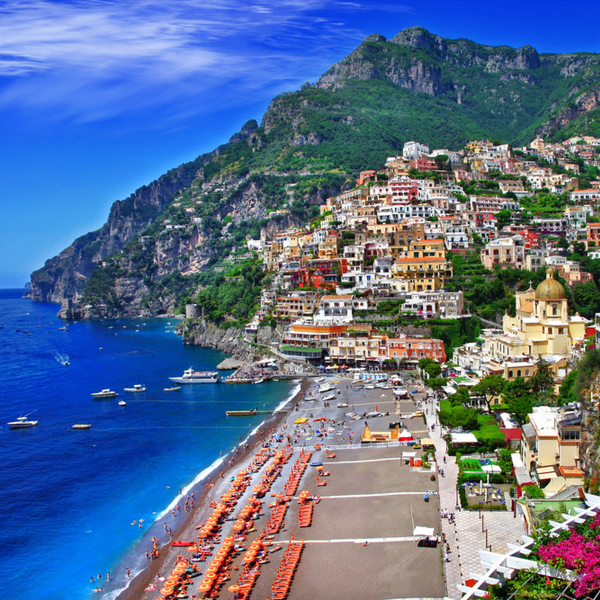 view of positano beach and cliffs