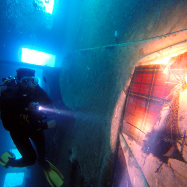 divers exploring a shipwreck in ayia napa
