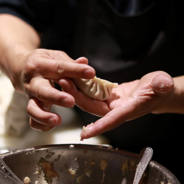 making dumplings at a beijing restaurant