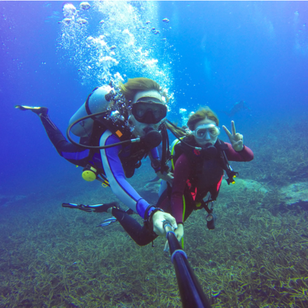 couple on their honeymoon diving together in bora bora